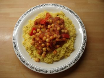 Plate of yellow spiced rice and chick pea curry